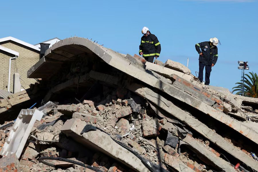 Rescuers work to rescue construction workers trapped under a building that collapsed in George, South Africa May 8, 2024. REUTERS PIC