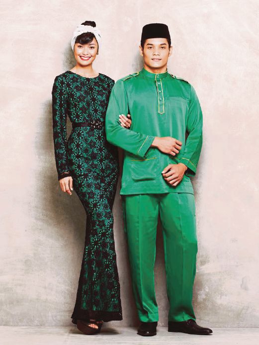 Matching kurung and baju Melayu.