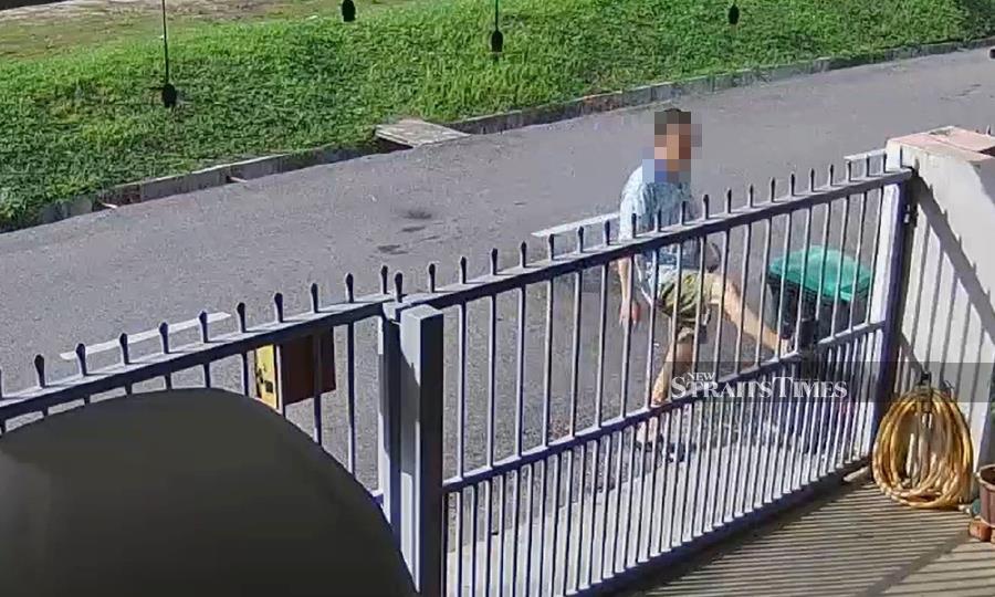 The man was captured on tape, allegedly kicking his neighbour’s gate. 