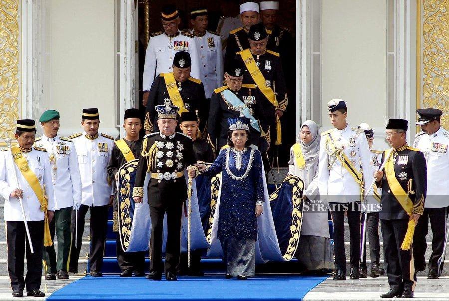 This file pic dated March 23, 2015, shows Sultan of Johor, Sultan Ibrahim Sultan Iskandar and Permaisuri of Johor, Raja Zarith Sofiah Sultan Idris Shah leaving for a parade after the coronation ceremony in Johor Baru.