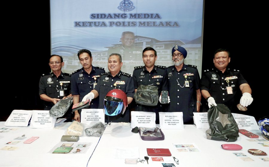 State police chief Datuk Abdul Jalil Hassan (third, left) said four more people are sought for investigations in connection with the arrests. (pix by RASUL AZLI SAMAD)