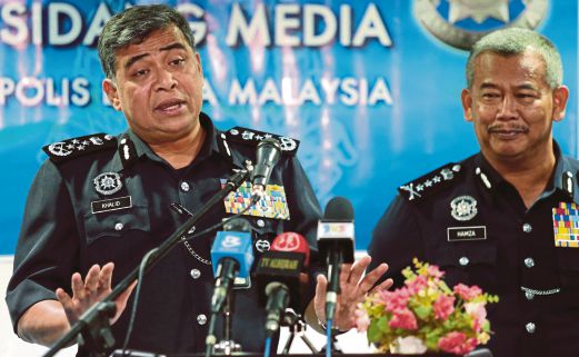 Inspector-General of Police Tan Sri Khalid Abu Bakar (left) with Sabah Police Commissioner Datuk Hamza Taib during a press conference at the state police headquarters in Kota Kinabalu yesterday. Pic by Edmund Samunting