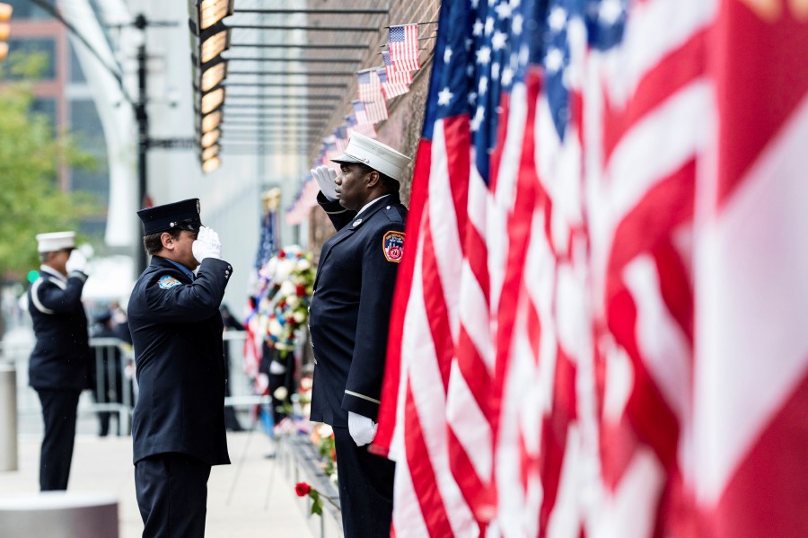 Firefighters salute each other outside the FDNY Engine 10, Ladder 10 fire station near the commemoration ceremony on the 21st anniversary of the September 11, 2001 terror attacks in New York. -AP PIC