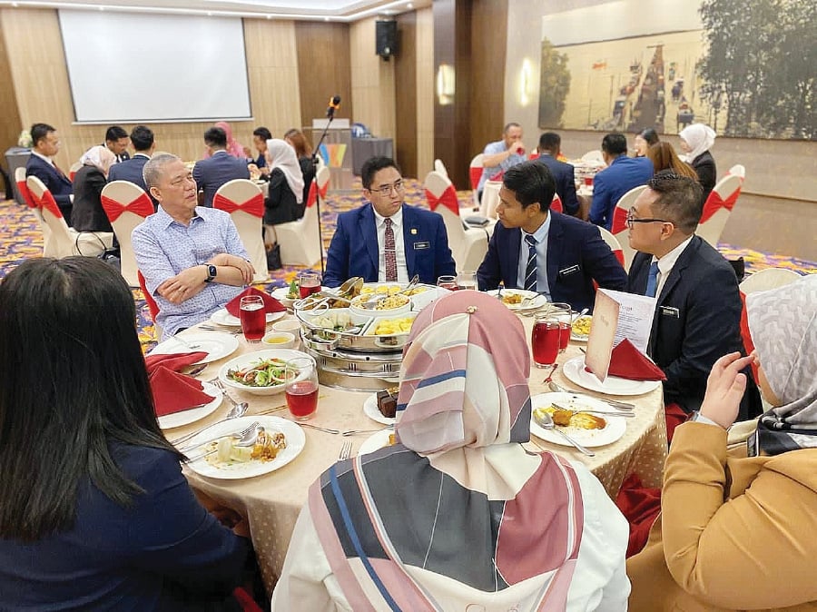 Deputy Prime Minister Datuk Seri Fadillah Yusof (left), the member of parliament for Petra Jaya, meeting junior diplomats in Kuching recently. -PIC COURTESY OF DR SHAZELINA ZAINUL ABIDIN