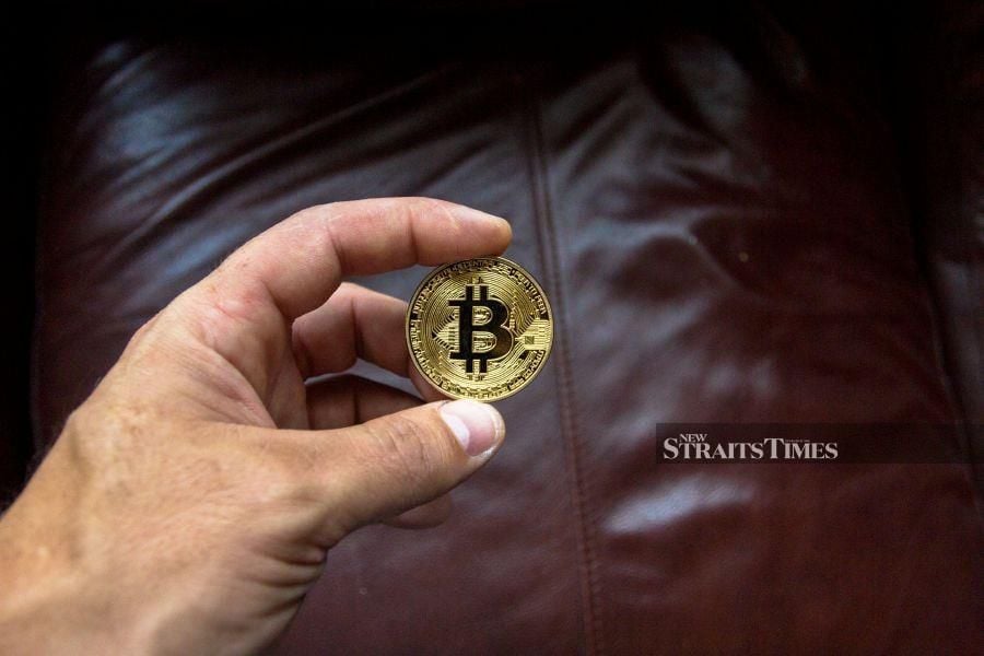 Bitcoin spiked above US$50,000 Tuesday for the first time in more than two years as investors grow optimistic that US approval of broader trading in the unit will ramp up demand.