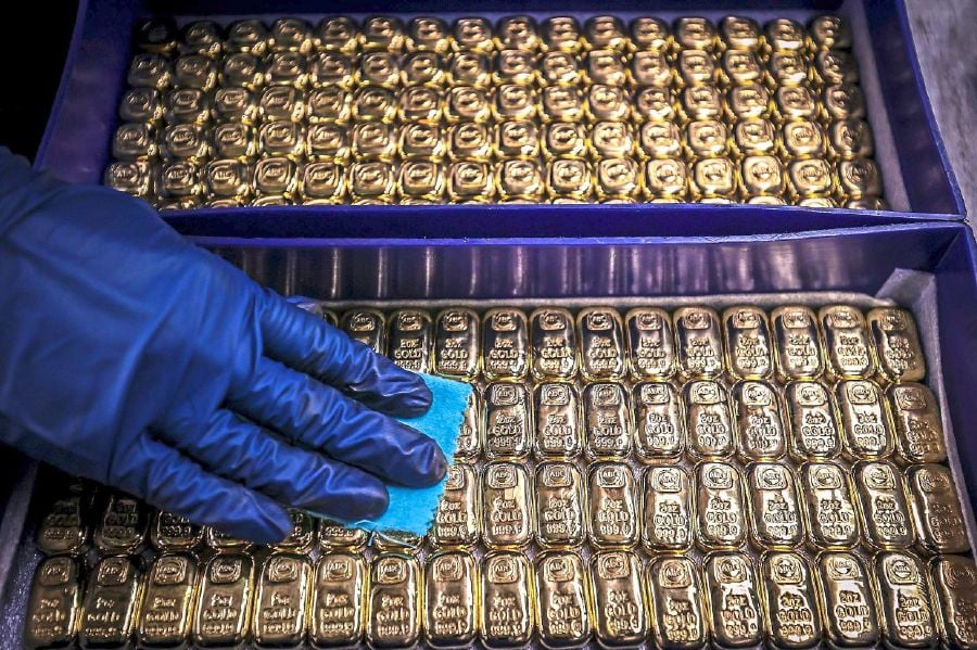 Spot gold fell 0.6 per cent to US$2,338.19 per ounce, as of 8:58 a.m. ET (1258 GMT). U.S. gold futures lost 0.1 per cent to US$2,360.7.(Photo by DAVID GRAY / AFP)