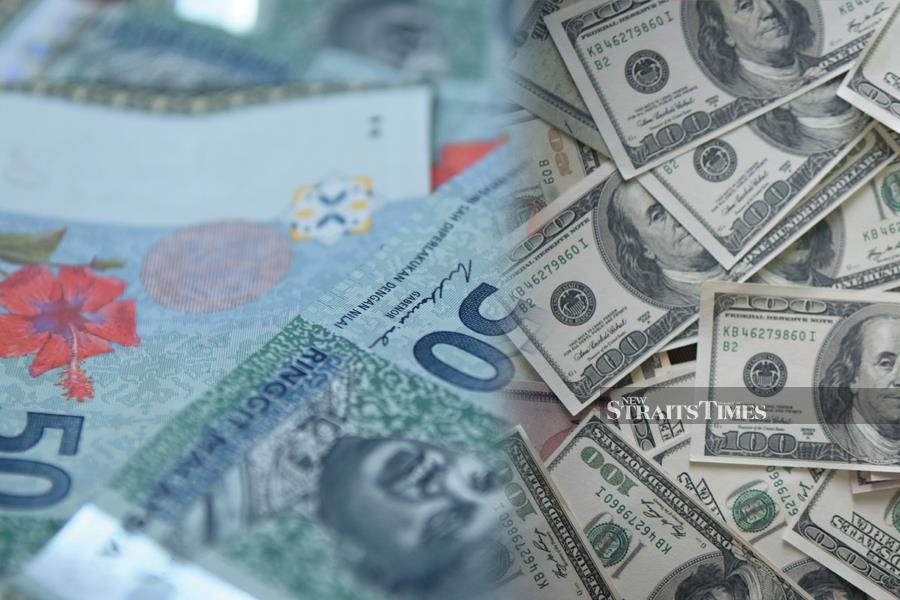A closeup shot of Malaysian Ringgit and US dollar bills