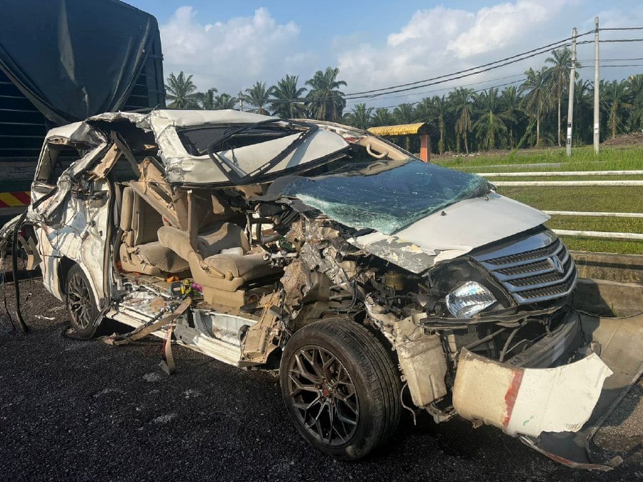 A Toyota Alphard driver and his elderly mother were killed after their vehicle crashed with a lorry in Jalan Permatang Kerat Telunjuk here yesterday evening. PIC COURTESY OF POLICE