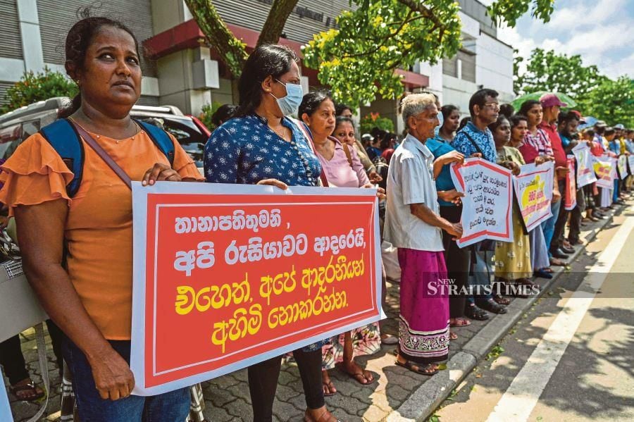 People protesting near the Russian embassy in Colombo on June 4, seeking the release of former Sri Lankan soldiers fighting for Russia and prisoners of war in Ukraine. AFP PIC