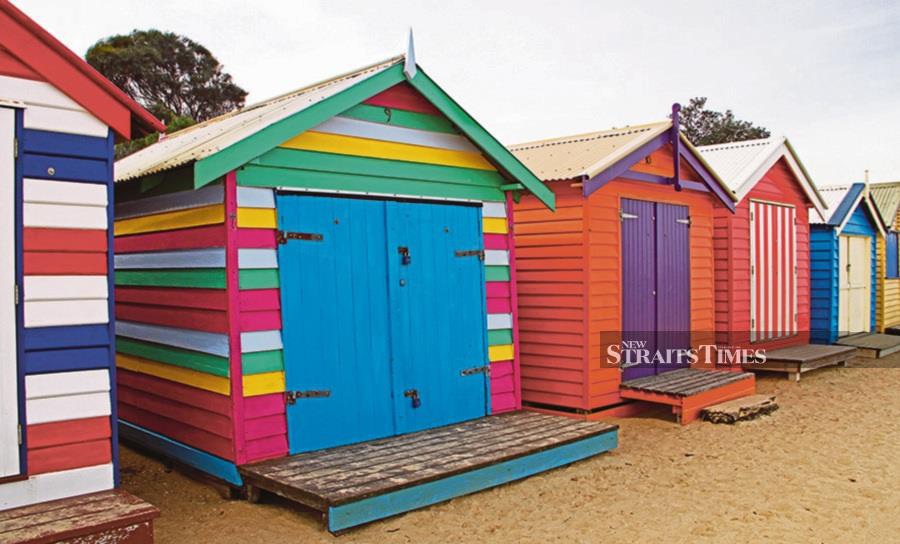 Photograph the colourful bathing sheds on Brighton Beach just south of the centre of Melbourne.