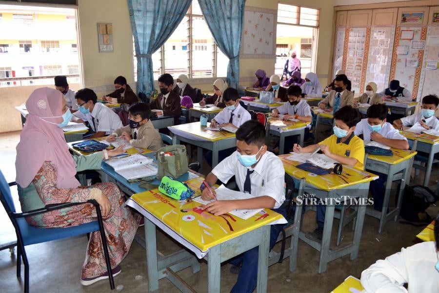 This April 27, 2021 file pic, shows students listening to their teacher at Sekolah Tunku Azizah, Kuantan. - NSTP file pic
