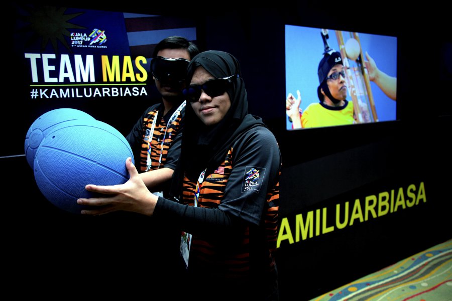 Goalball player Siti Hajar Hassan with Muhammad Haiqal Azani Azman