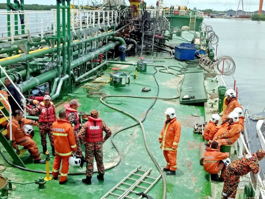 Firemen tend to an oil tanker in Tanjung Manis this morning. An explosion aboard the tanker left two people severely injured, with the vessel’s captain also sustaining injuries. Pix courtesy of Fire and Rescue Department