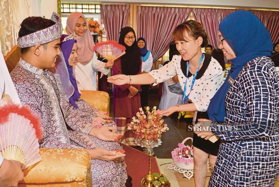 A couple receiving blessings at their wedding. The writer remembers her aunties, uncles and cousins, who never failed to turn up days before a family wedding to help with the preparations. FILE PIC 