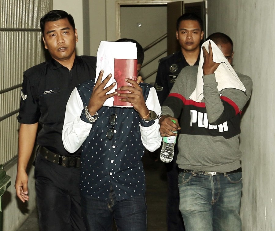 Judge Mabel S. Muttiah meted out the sentences on mechanic S. Theventhiran (right) and Nagan Kumar (left) to 10 years’ jail for committing armed gang robbery at a hotel in January. (NSTP/SAIFULLIZAN TAMADI)