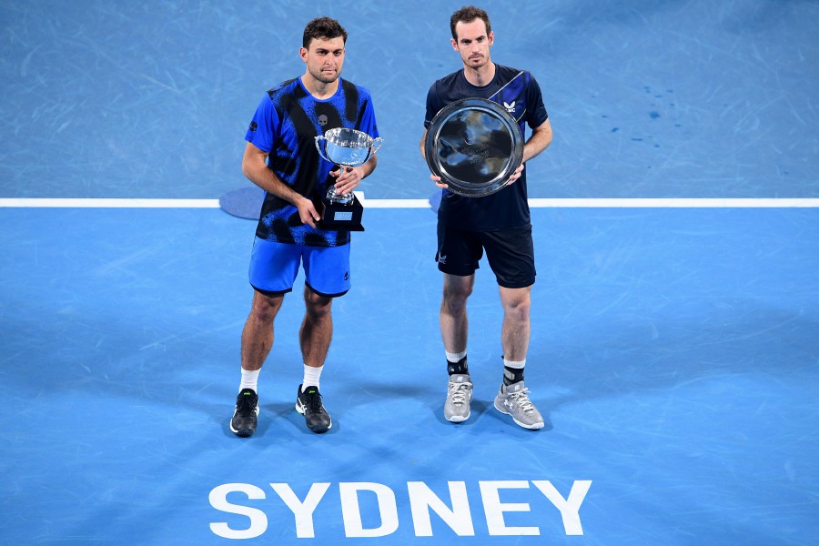 Aslan Karatsev of Russia (left) and Andy Murray of Great Britain pose for photographs following the Menâ€™s Final on Day 6 of the Sydney Tennis Classic at Sydney Olympic Park in Sydney, Australia, 15 January 2022. -EPA PIC