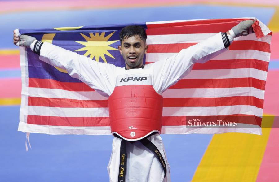 National taekwondo exponent Syafiq Zuber successfully defended his men’s welterweight (80kg) gold medal at the Sea Games today. -NSTP/MOHAMAD SHAHRIL BADRI SAALI