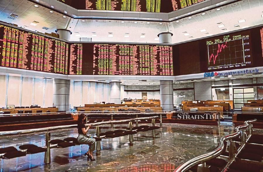 Bursa Malaysia continued its downtrend to close lower as geopolitical tensions, and surprisingly strong US retail data, led spooked investors to seek cover. STR/HAZREEN MOHAMAD