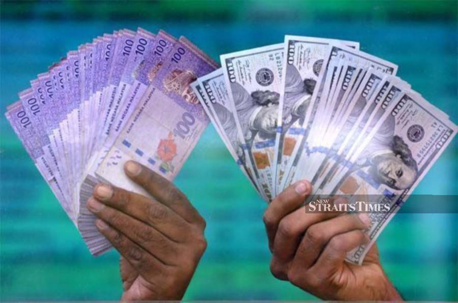 The ringgit opened higher against the US dollar on Friday after the United States Federal Reserve (Fed) decided to maintain its interest rate at 5.5 per cent.