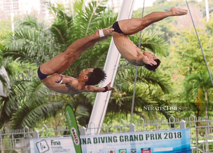 The men's 3m springboard synchro pairing of Ooi Tze Liang-Syafiq Puteh have to up their game if they are to make the Hangzhou Asian Games podium in two months. -NSTP file pic