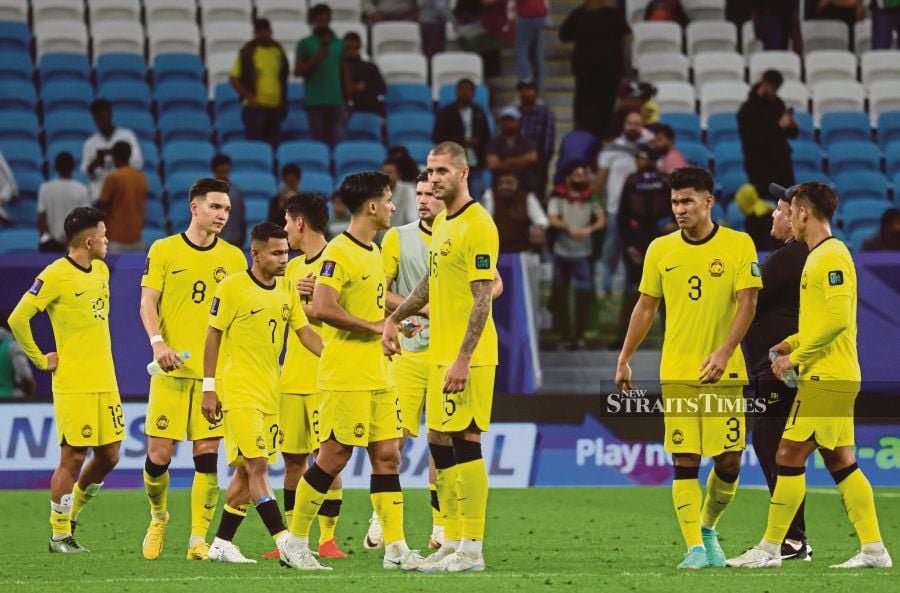  Malaysia players are dejected after losing 4-0 to Jordan in an Asian Cup match in Doha yesterday. BERNAMA pic 