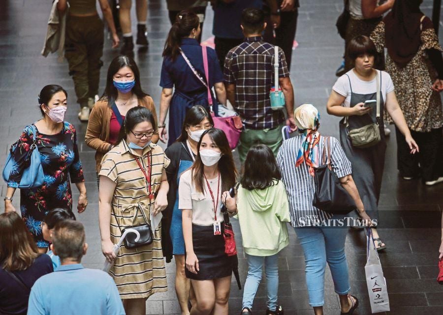 People wearing face masks in Kuala Lumpur recently. An expert urges people to be extra cautious against Covid-19 in the next few weeks. -NSTP/ASWADI ALIAS 