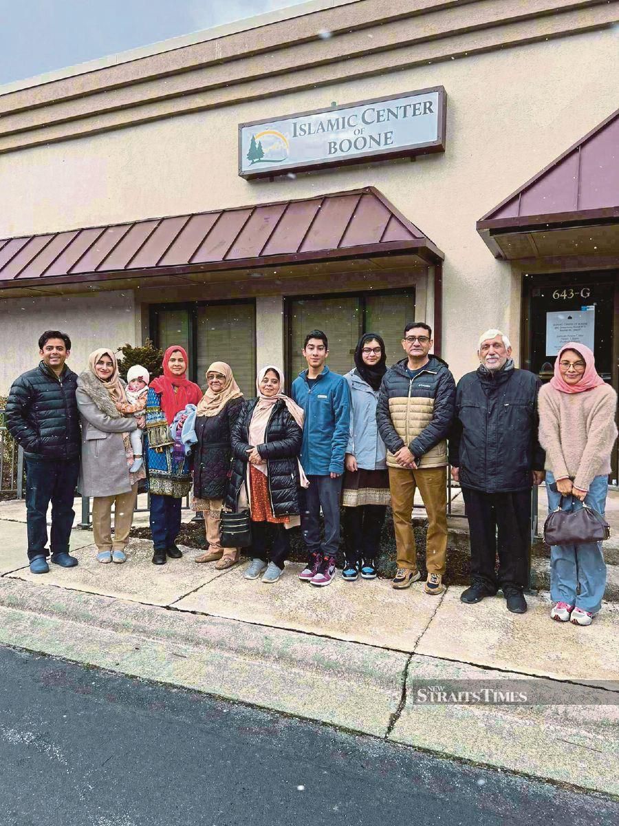 Marina Mustafa Batchelor (right) and Dr Khurram Tariq (left) with some members of the Boone Muslim community outside their mosque in North Carolina, the United States.- Pic courtesy of Marina Mustafa Batchelor