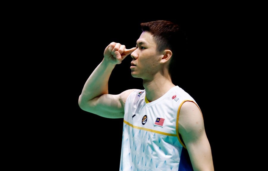 Lee Zii Jia reacts after winning his quarter final match against Japan's Kodai Naraoka. -Reuters pic