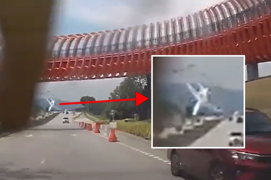 A Twitter video screen grab of a dashcam recording of the final moments of the Beechcraft Premier 1 aircraft showed the plane appearing to nose-dive into what seemed to be a white vehicle on the Elmina Highway.-Pic screen captured from social media video
