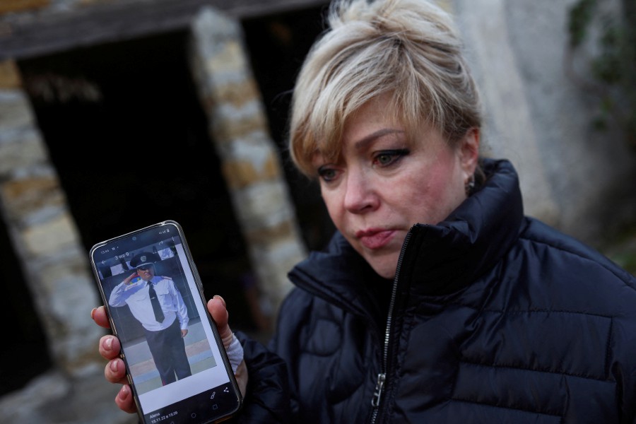 Aliona Lapchuk shows a picture of her husband Vitaliy who she says was tortured and left to die by Russian forces in Kherson at the beginning of the war, during an interview with Reuters in Krasne in Mykolaiv region, Ukraine. -REUTERS file pic