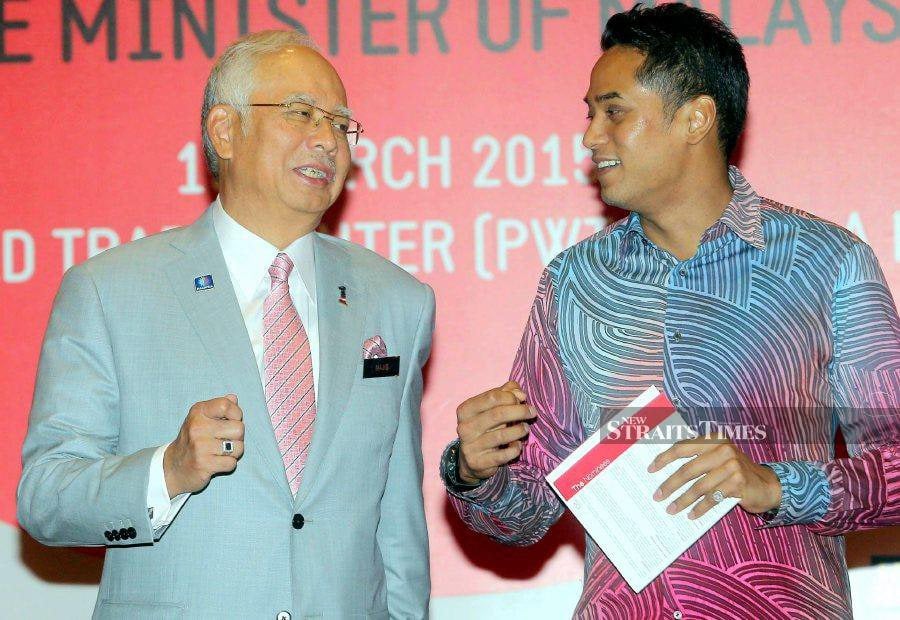 A file pic dated March 19, 2015, shows then Prime Minister Datuk Seri Najib Razak (left) speaking to then Youth and Sports Minister Khairy Jamaluddin during the International Conference For Young Leaders at PWTC, in Kuala Lumpur. - NSTP file pic