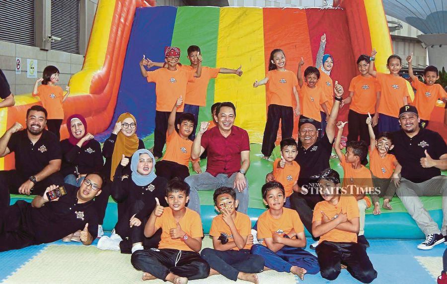 Education Ministry sports, co-curriculum and arts department director Zainal Abas (in red) with the Kids Warrior Challenge participants at its launch in Kuala Lumpur yesterday. - NSTP/Saifullizan Tamadi.