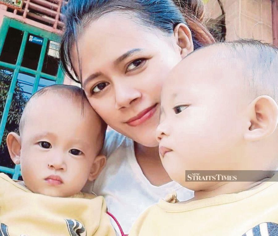 Indonesian-born Septi Yani and her twin babies are waiting to reunite with her husband in Malaysia once borders fully reopen. - Pic courtesy of Septi Yani 