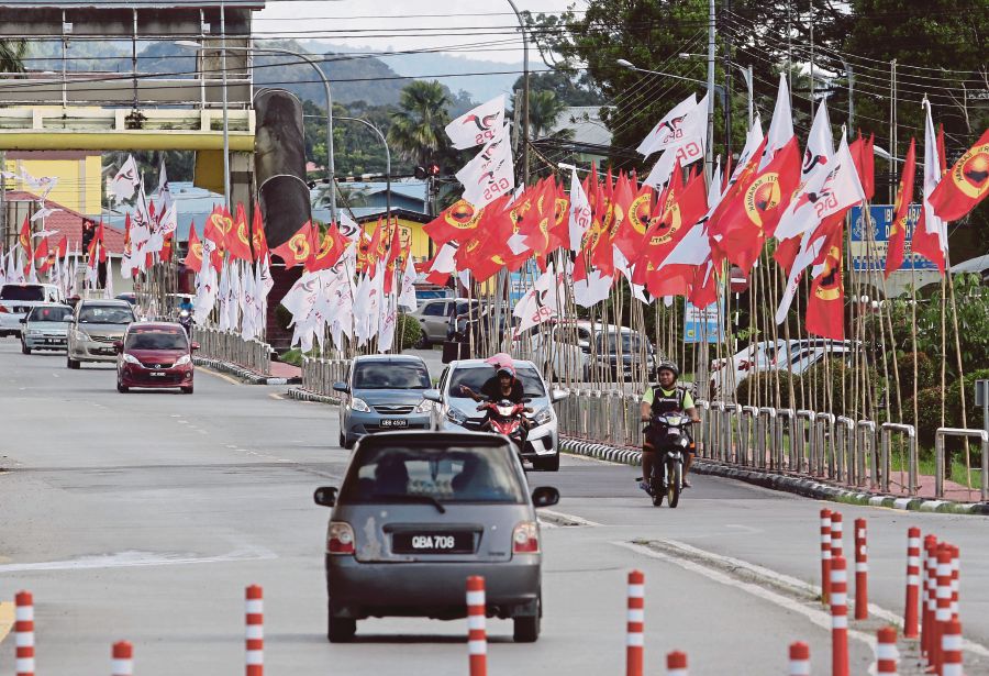 Party and coalition flags lining a street in Sri Aman in December 2021 ahead of the Sarawak state election. The state’s power equation was perhaps irrevocably changed after Parti Pesaka Bumiputera Bersatu fielded candidates in and won 47 seats. FILE PIC 