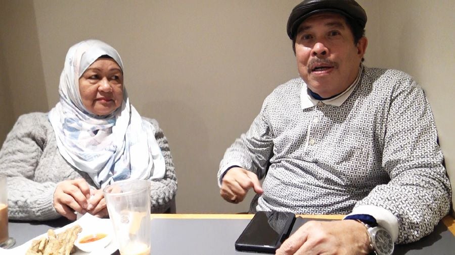 Datuk Abdul Malek Abdul Hamid and his wife, Datin Norhayati Mohd Nor in London. He is still able to vividly recall the 1989 plane crash on the Subang Highway that he survived. PIC BY ZAHARAH OTHMAN