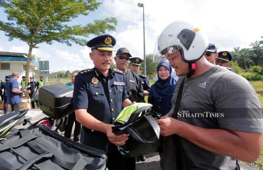 State Road Transport Department deputy director Mohd Edir Sanip (left) said based on discussions with highway concessionaire Plus, traffic in the state is expected to double from its daily count of 2 million vehicles. NSTP/NUR AISYAH MAZALAN