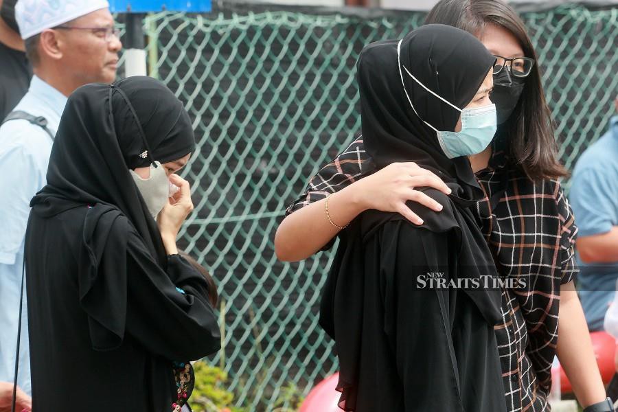 Family and relatives of the victims could not hold back their tears as they waited on the grounds of Tengku Ampuan Rahimah Hospital's Forensic Department following the accident of a Beechcraft Model 390 (Premier 1) aeroplane. Federal Criminal Investigation Director Datuk Seri Mohd Shuhaily Mohd Zain has urged everyone to respect the family members of those killed in the Elmina tragedy. -NSTP/FAIZ ANUAR