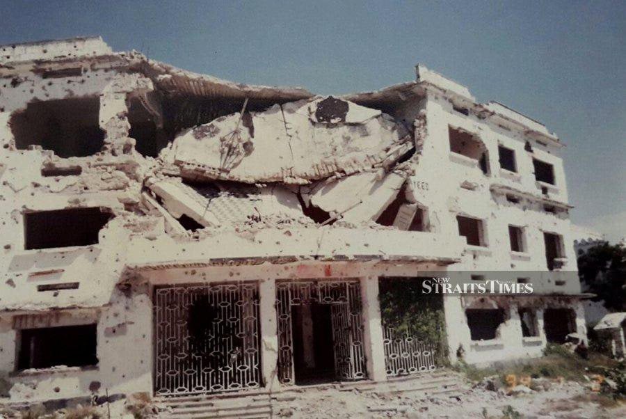 A view of a building damaged during the Black Hawk Down incident in Somalia. - NSTP file pic 