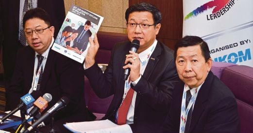 Pikom chairman Cheah Kok Hoong (centre) with (from left) adviser Woon Tai Hai and councillor Eric Wong at the media briefing yesterday. Pic by Ahmad Ikhmal Hisham Murad