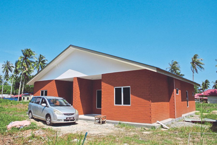 A completed semi-detached house owned by one of the villagers in Pengerang.