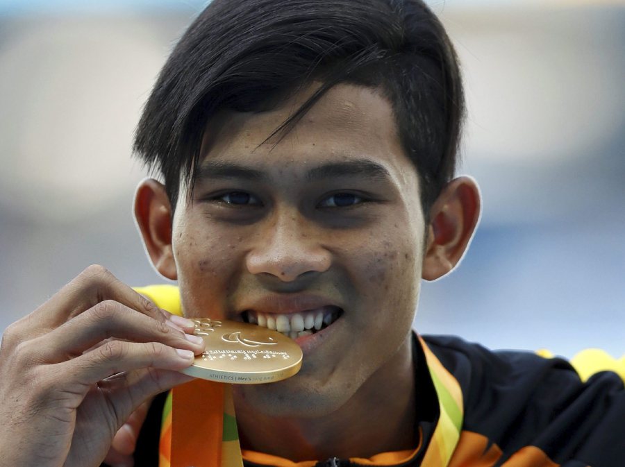Abdul Latif Romly of Malaysia celebrates with his Olympic gold medal win in Rio. Many Malaysians have expressed confidence that the nation’s athletes will clinch 111 gold medals in the 2017 Sea Games. Pic by Reuters