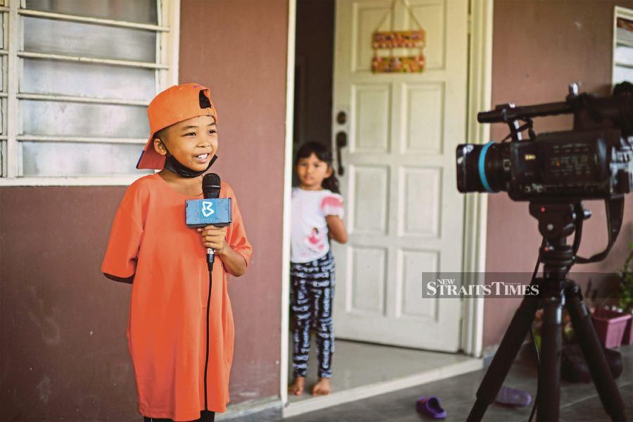 Muhammad Haziq Mohd Asyraf answering questions in an interview at his home in Sungai Petani recently.  - BERNAMA PIC  