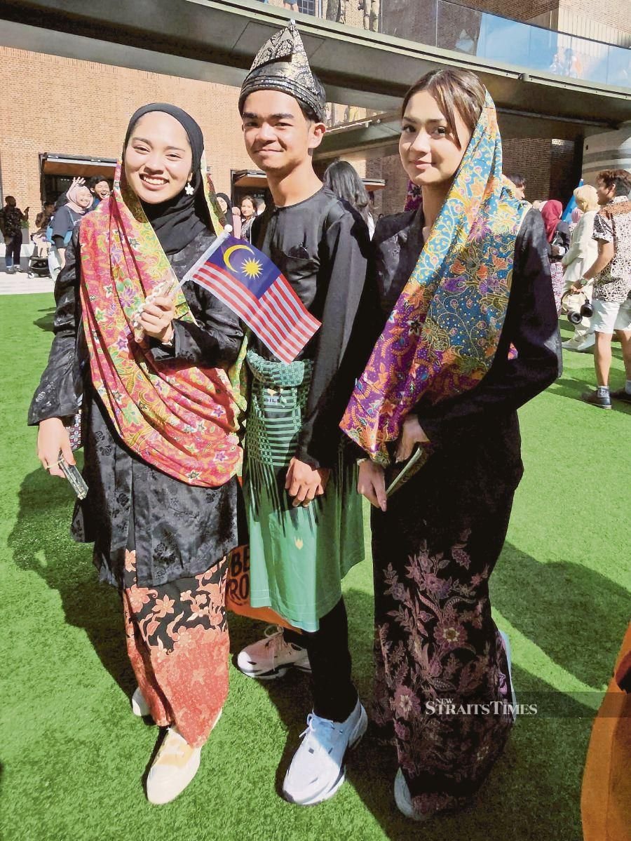 Malaysians looking resplendent in their traditional attire.