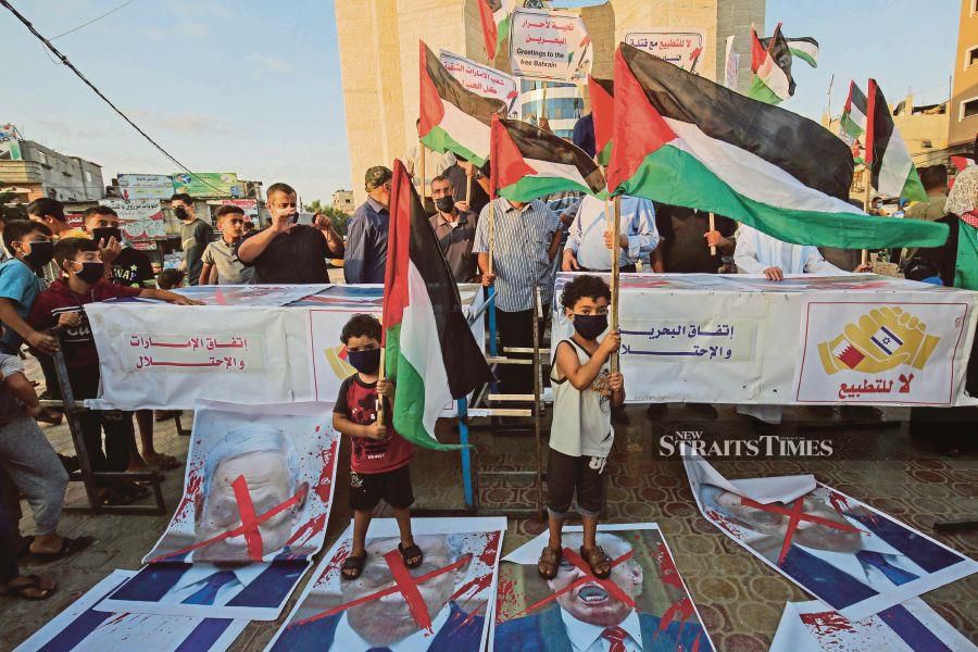 Palestinians protesting in Rafah in the southern Gaza Strip against Israeli normalisation deals with the