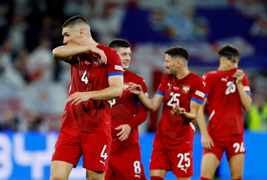 Serbian players react after the match against England at Arena AufSchalke, Gelsenkirchen, Germany on June 16. - REUTERS PIC