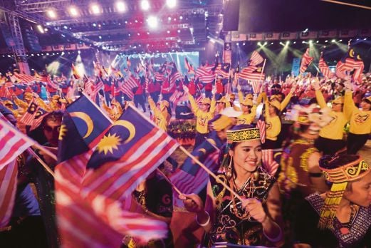  Malaysians celebrating Malaysia Day in Miri, Sarawak, on Tuesday. Malaysians should work together for the betterment of the whole nation, be it Malaya, Sabah or Sarawak. 