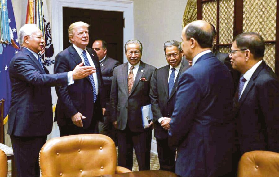 Prime Minister Datuk Seri Najib Razak introducing Malaysian officials to US President Donald Trump in Washington DC recently. Despite challenging global economic times, a study found that 63 per cent of US companies expect to profit in Malaysia this year.
