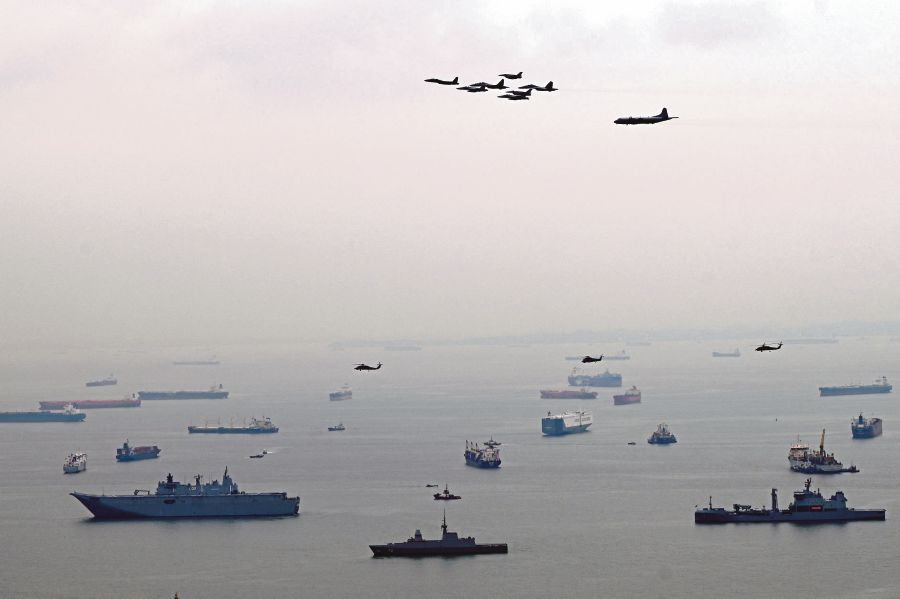 Aircraft from the Five Power Defence Arrangements (FPDA) member-nations –- Australia, Malaysia, New Zealand, Singapore, and the United Kingdom -- take part in a flypast during a combined formation display to mark the pact's 50th anniversary in Singapore. -AFP PIC