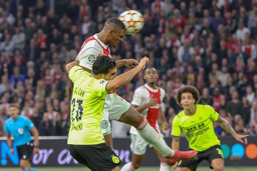 Ajax Amsterdam's Ivorian forward Sebastien Haller (C) heads the ball to score his team's fourth goal during the UEFA Champions League Group C football match Ajax v Borussia Dortmund at the Johan Cruijff Arena in Amsterdam, the Netherlands. - AFP pic