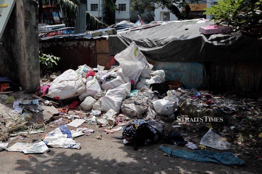 This file pic dated Jan 17, 2018, shows rubbish thrown a long a road in Pantai Dalam. -NSTP/File pic